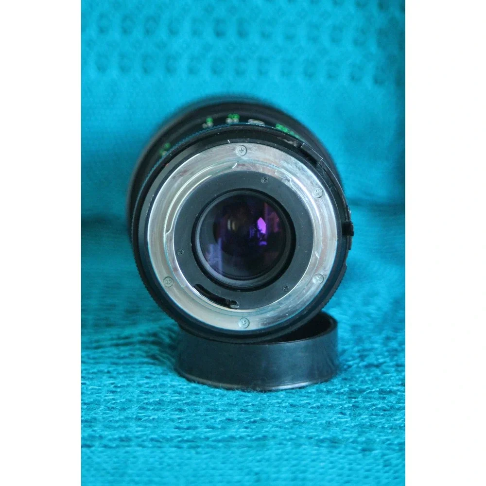 Vivitar 75-205 MM F1:3.8 Lens for Minolta MC mount with 2x converter.